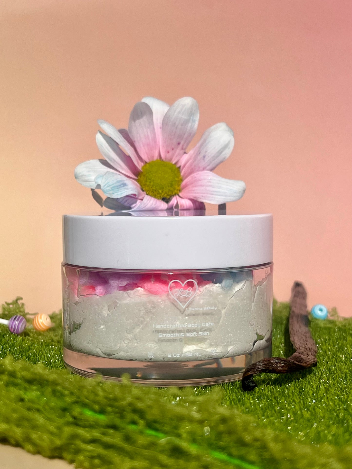 white shimmer base with multi colour flower top body scrub, floral fruity body exfoliant. A foaming/cleansing and exfoliating gentle body scrub to achieve smooth soft skin. UK handmade Vegan skincare that brings a fun luxurious experience to self care and shower routines. Scrub and get rid of patchy dry skin, clogged pores and ingrown hairs. The best body scrub you could ever ask for.