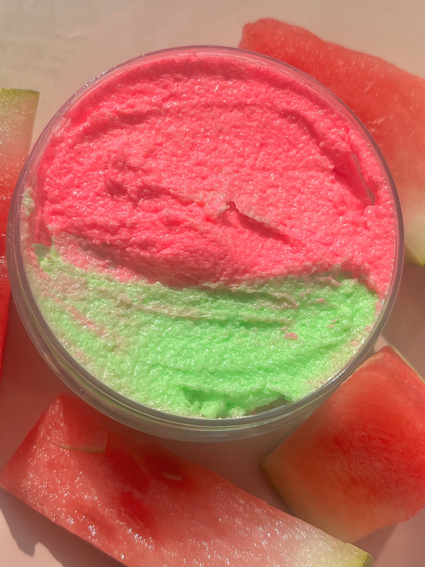 pink and green watermelon body scrub, summer fruit body exfoliant. A foaming/cleansing and exfoliating gentle body scrub to achieve smooth soft skin. UK handmade Vegan skincare that brings a fun luxurious experience to self care and shower routines. Scrub and get rid of patchy dry skin, clogged pores and ingrown hairs. The best body scrub you could ever ask for.