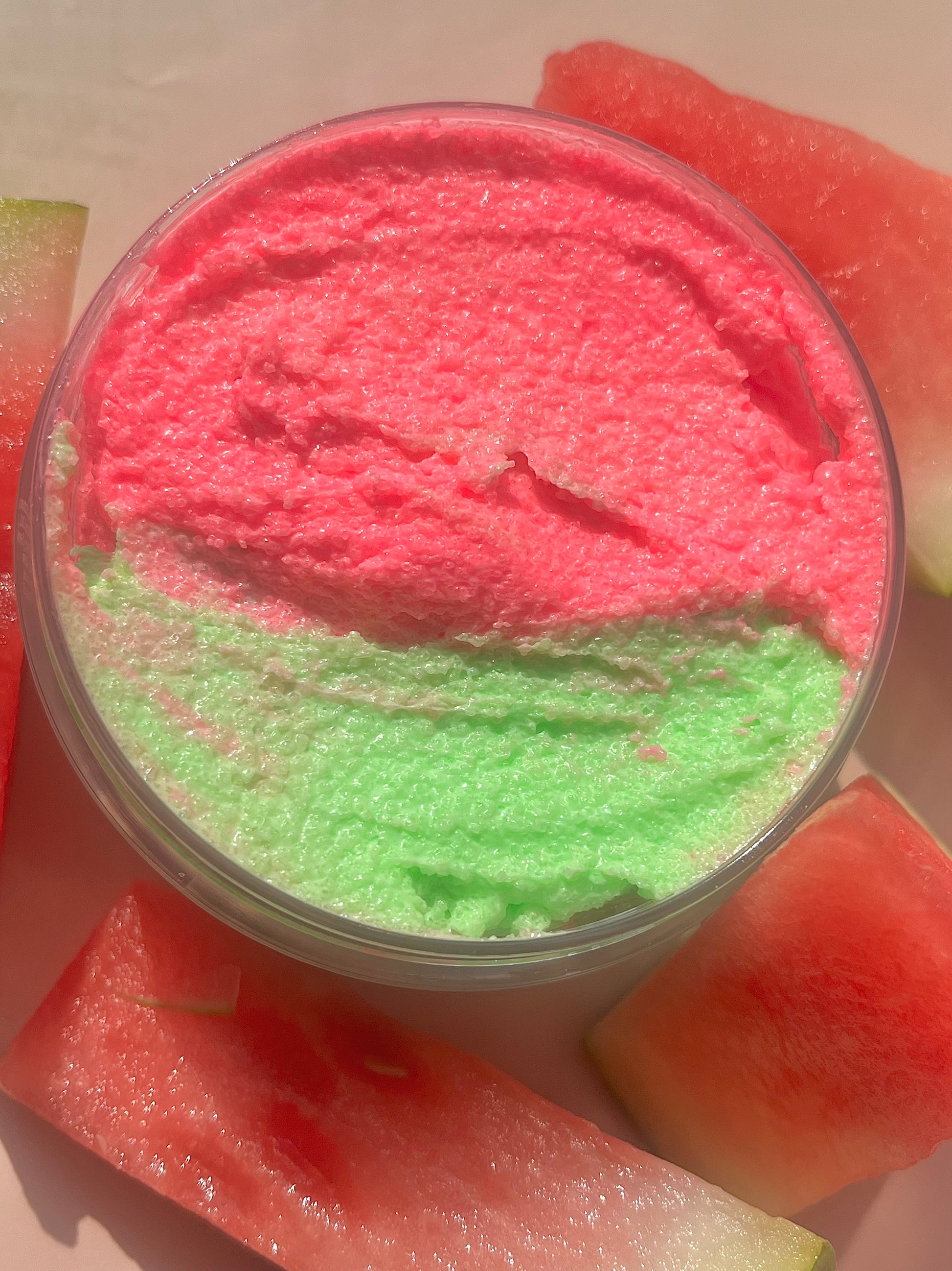 pink and green watermelon body scrub, summer fruit body exfoliant. A foaming/cleansing and exfoliating gentle body scrub to achieve smooth soft skin. UK handmade Vegan skincare that brings a fun luxurious experience to self care and shower routines. Scrub and get rid of patchy dry skin, clogged pores and ingrown hairs. The best body scrub you could ever ask for.