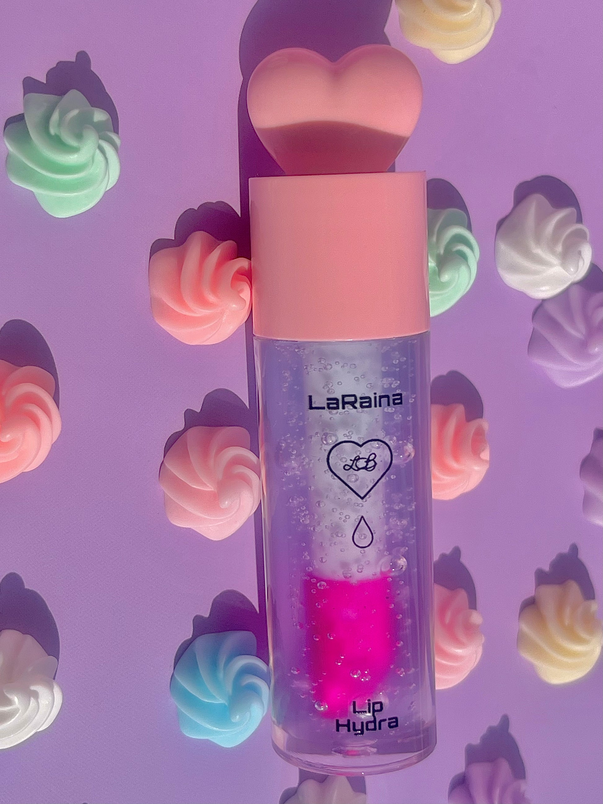 Color-changing pH-reactive lip gloss that starts blue and transforms into a custom pink. Provides deep hydration while adapting to your lips for a soft, personalised tint. Lightweight feel with lasting comfort and high shine.