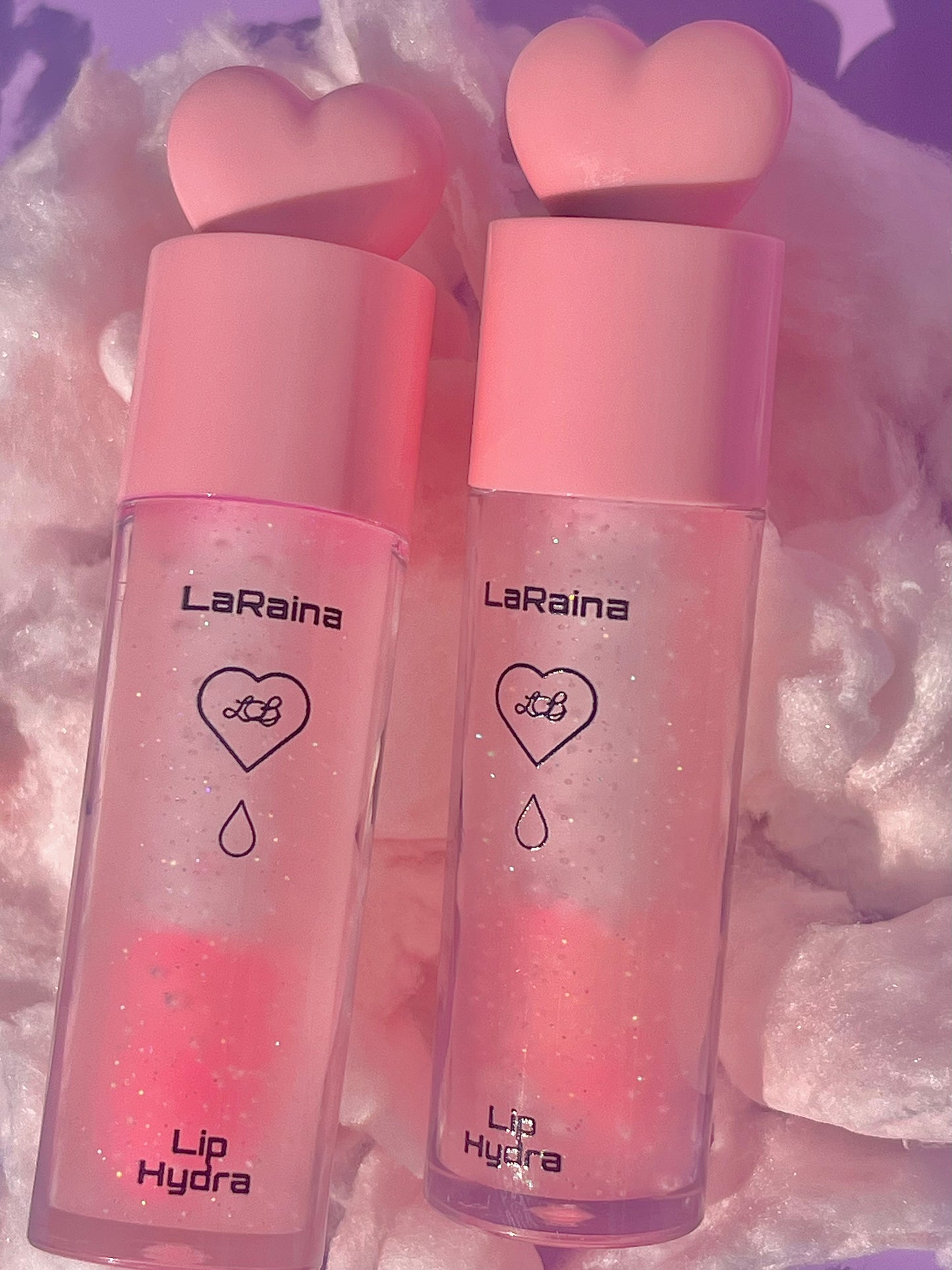 Sweet cotton candy-scented pH-reactive lip gloss that shifts to a custom pink with a touch of shimmer and glitter. Nourishes and hydrates lips while delivering a soft, glossy glow that stays put. Perfect for sparkle lovers with dry or sensitive lips.