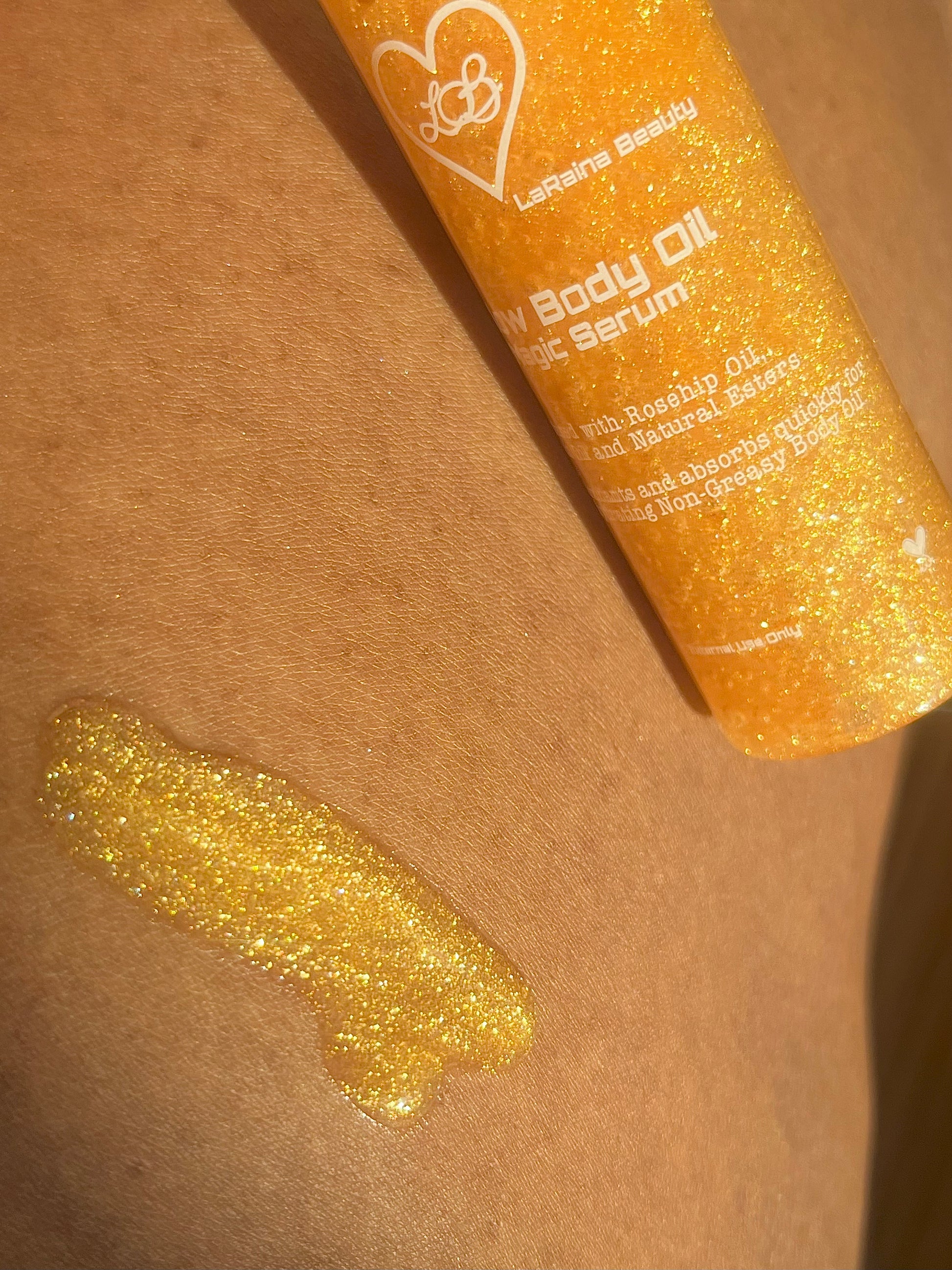 Golden Shimmer Glitter Body oil or serum bottle with a droplet on skin