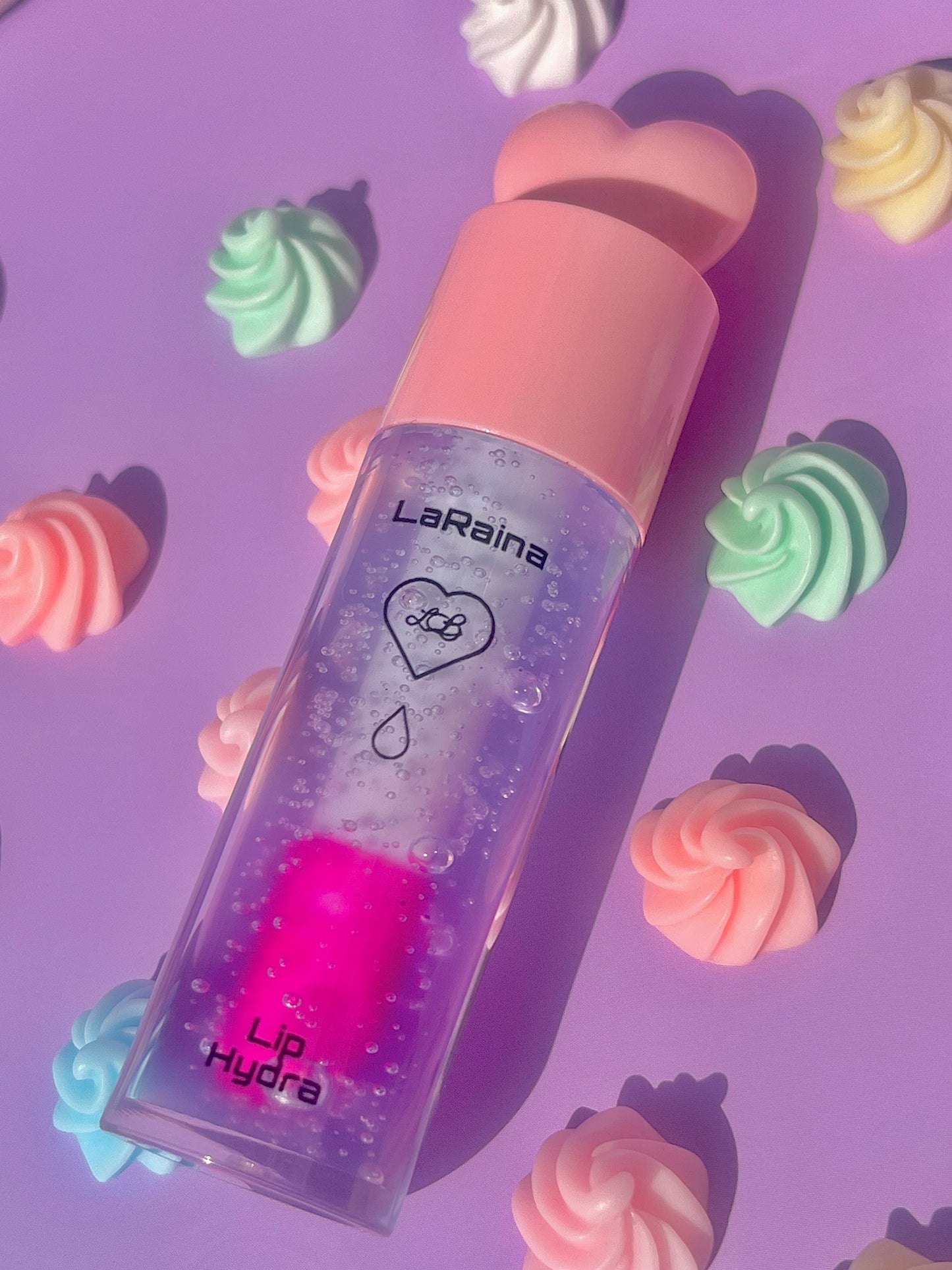 Color-changing pH-reactive lip gloss that starts blue and transforms into a custom pink. Provides deep hydration while adapting to your lips for a soft, personalised tint. Lightweight feel with lasting comfort and high shine.