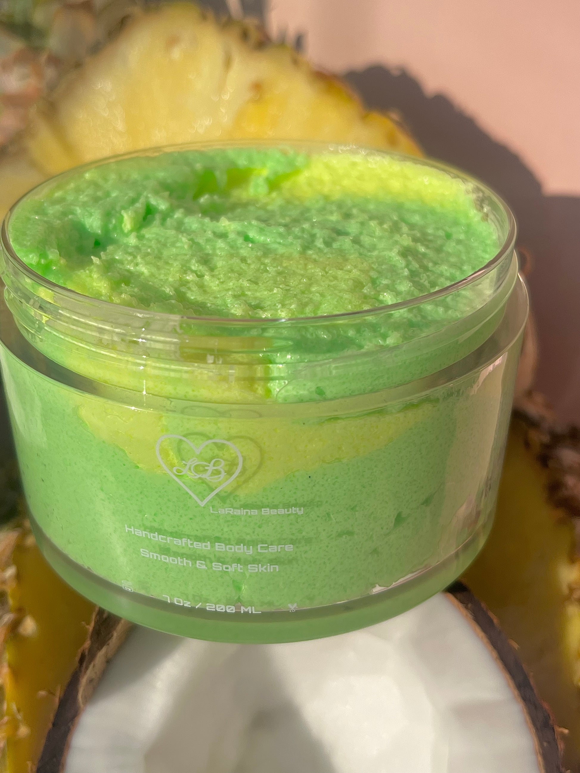 Pineapple Coconut tropical juicy Pina Colada body scrub. A foaming/cleansing and exfoliating gentle body scrub to achieve smooth soft skin. UK handmade Vegan skincare that brings a fun luxurious experience to self care and shower routines. Scrub and get rid of patchy dry skin, clogged pores and ingrown hairs. The best body scrub you could ever ask for.
