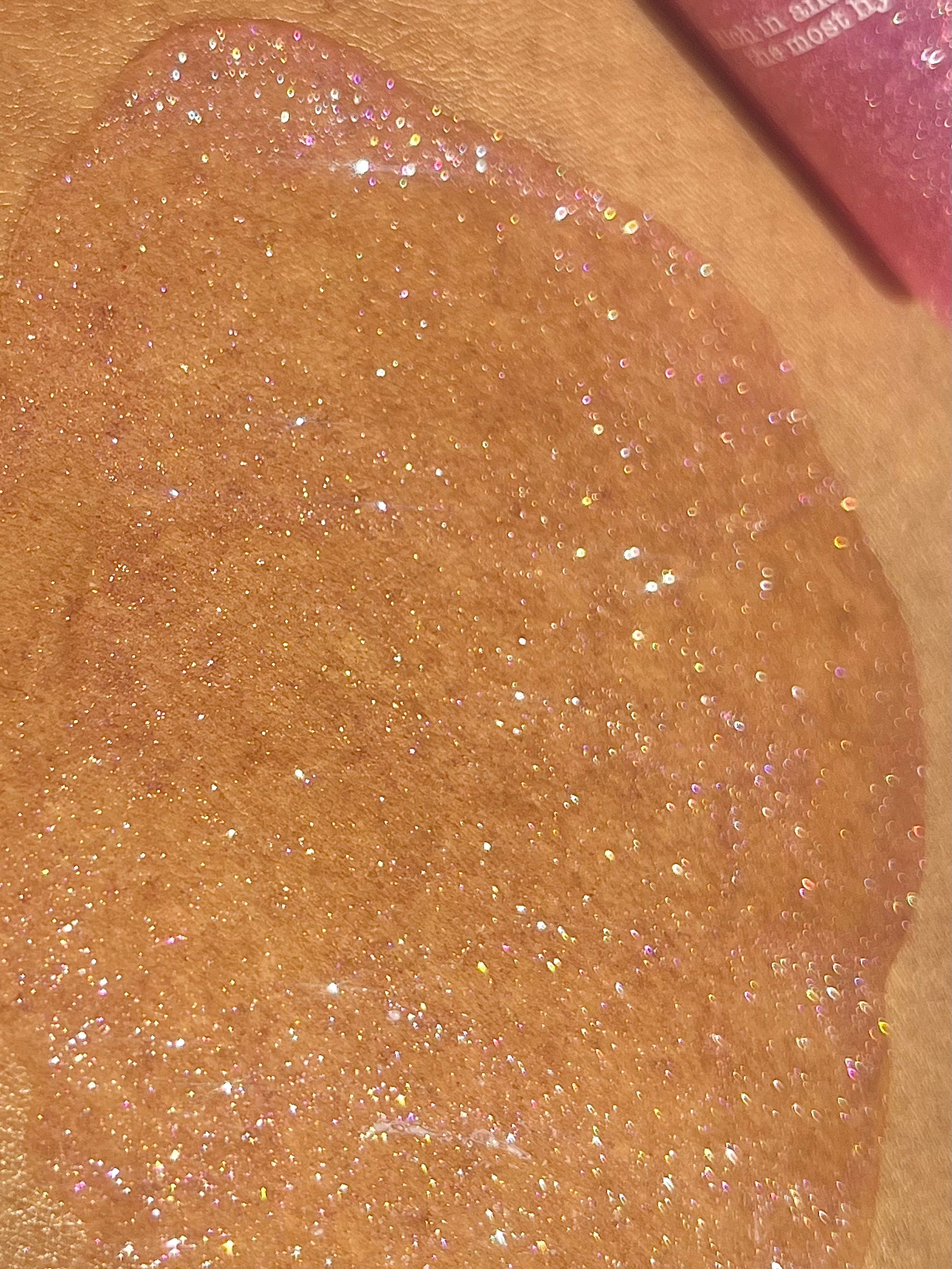 CLOSE UP: Galaxy Veil is a Shimmer body oil with a soft gel texture for a hydrating radiant skin that leaves a multi-coloured and dimensional glow. This glow elixir is Made with plant oils and biodegradable glitter, the luminous body care serum brings a mystical experience to life with the popular unicorn scent.