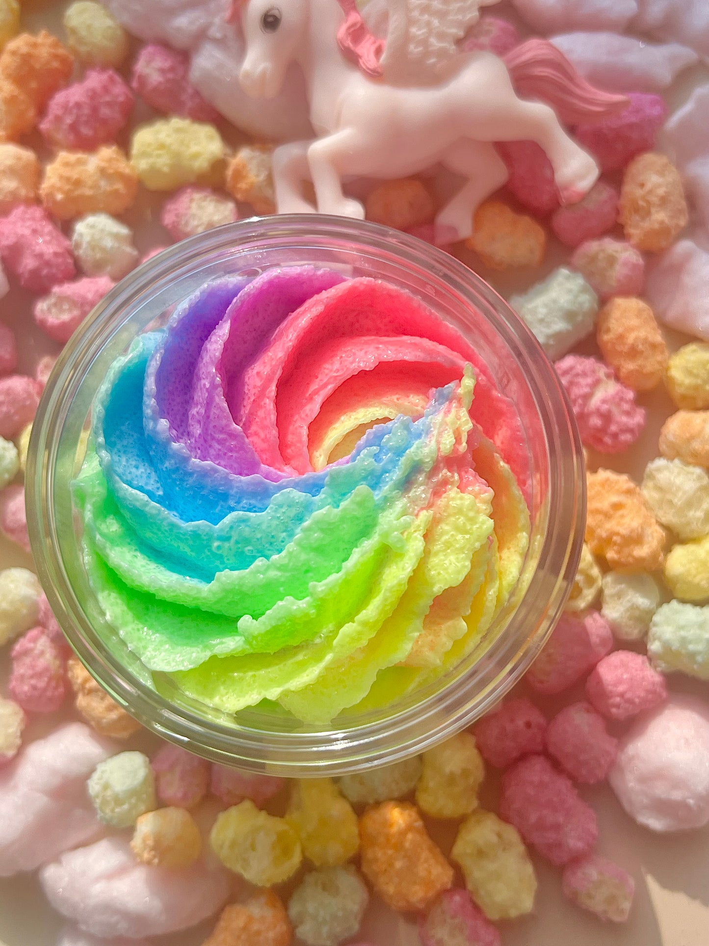 rainbow unicorn body scrub, fruit body exfoliant. A foaming/cleansing and exfoliating gentle body scrub to achieve smooth soft skin. UK handmade Vegan skincare that brings a fun luxurious experience to self care and shower routines. Scrub and get rid of patchy dry skin, clogged pores and ingrown hairs. The best body scrub you could ever ask for.
