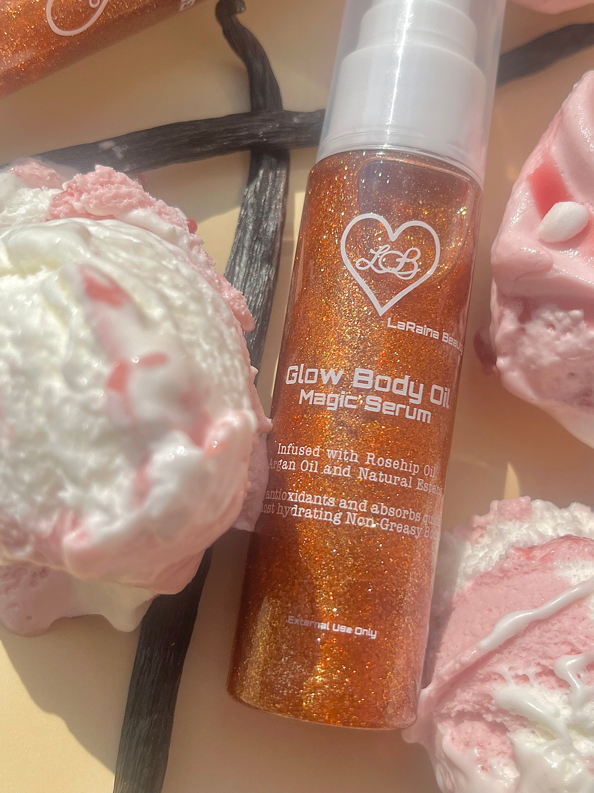 Glow Body Oil Magic Serum bottle with vanilla bean and whipped cream in the background