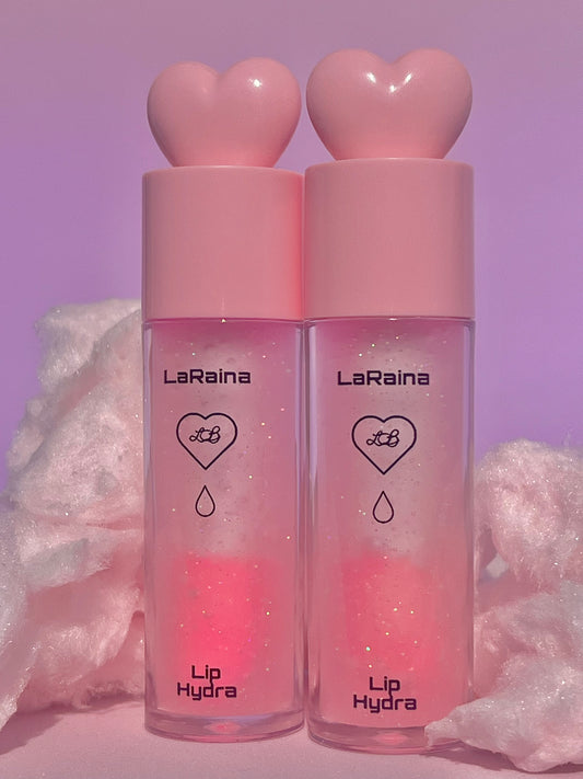 Sweet cotton candy-scented pH-reactive lip gloss that shifts to a custom pink with a touch of shimmer and glitter. Nourishes and hydrates lips while delivering a soft, glossy glow that stays put. Perfect for sparkle lovers with dry or sensitive lips.