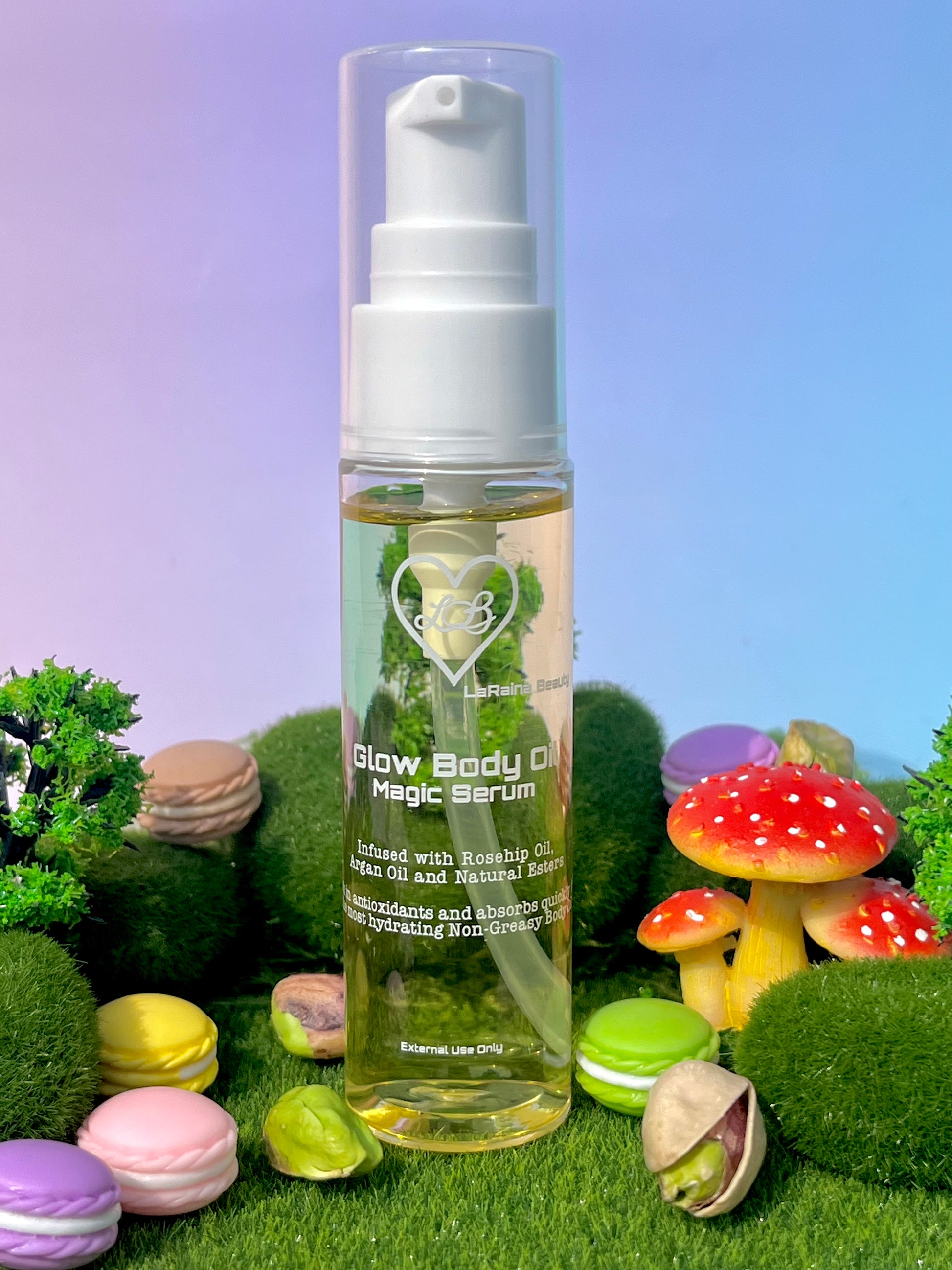 Bottle of 'Glow Body Oil Magic Serum' with colorful macarons and mushrooms in the background